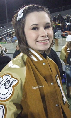 Image: IHS cheerleader Meagan Hooker breaks a nervous smile before the start of the game.