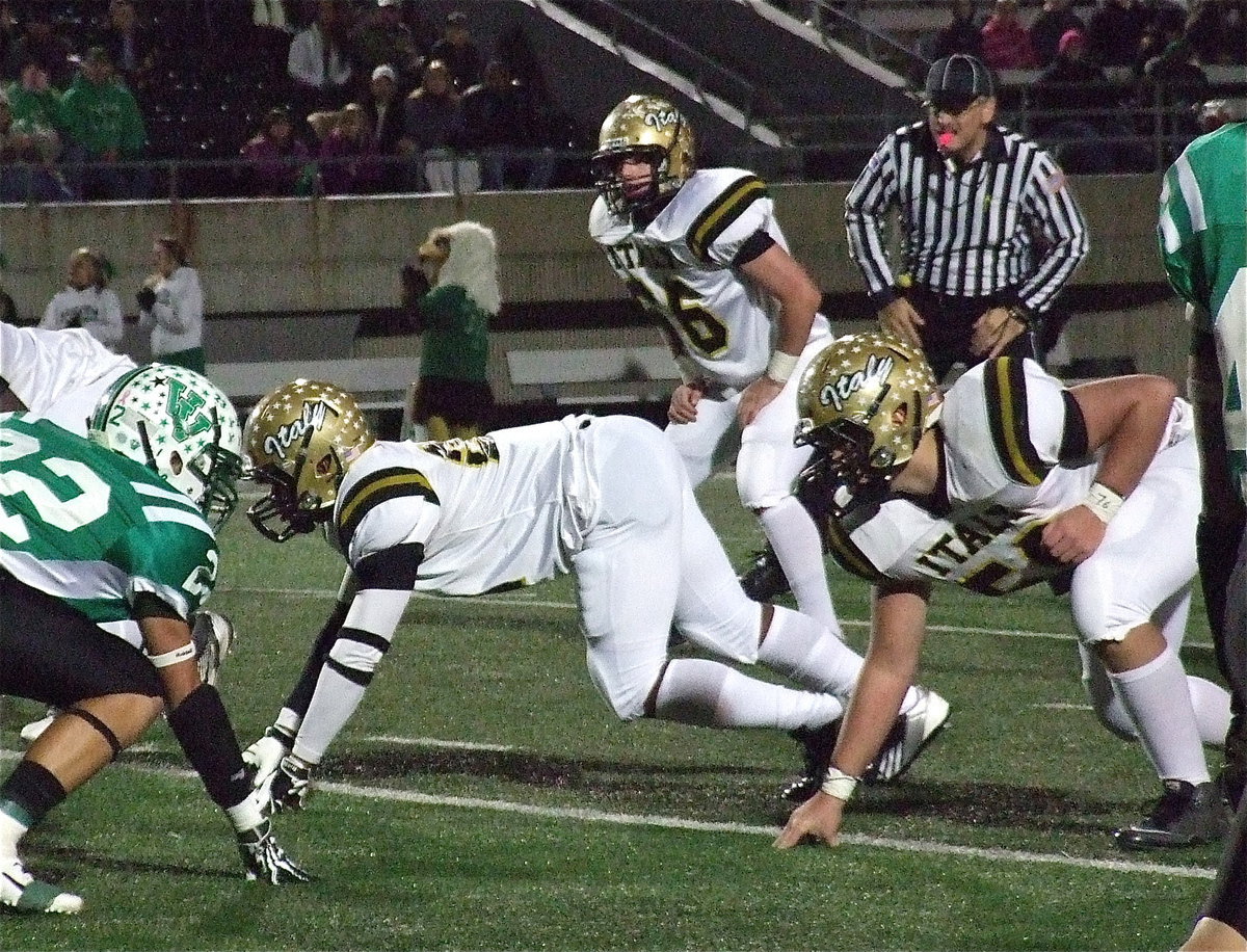 Image: Jalarnce Lewis(21), Kyle Fortenberry (66) and Zain Byers(50) dig in on defense.