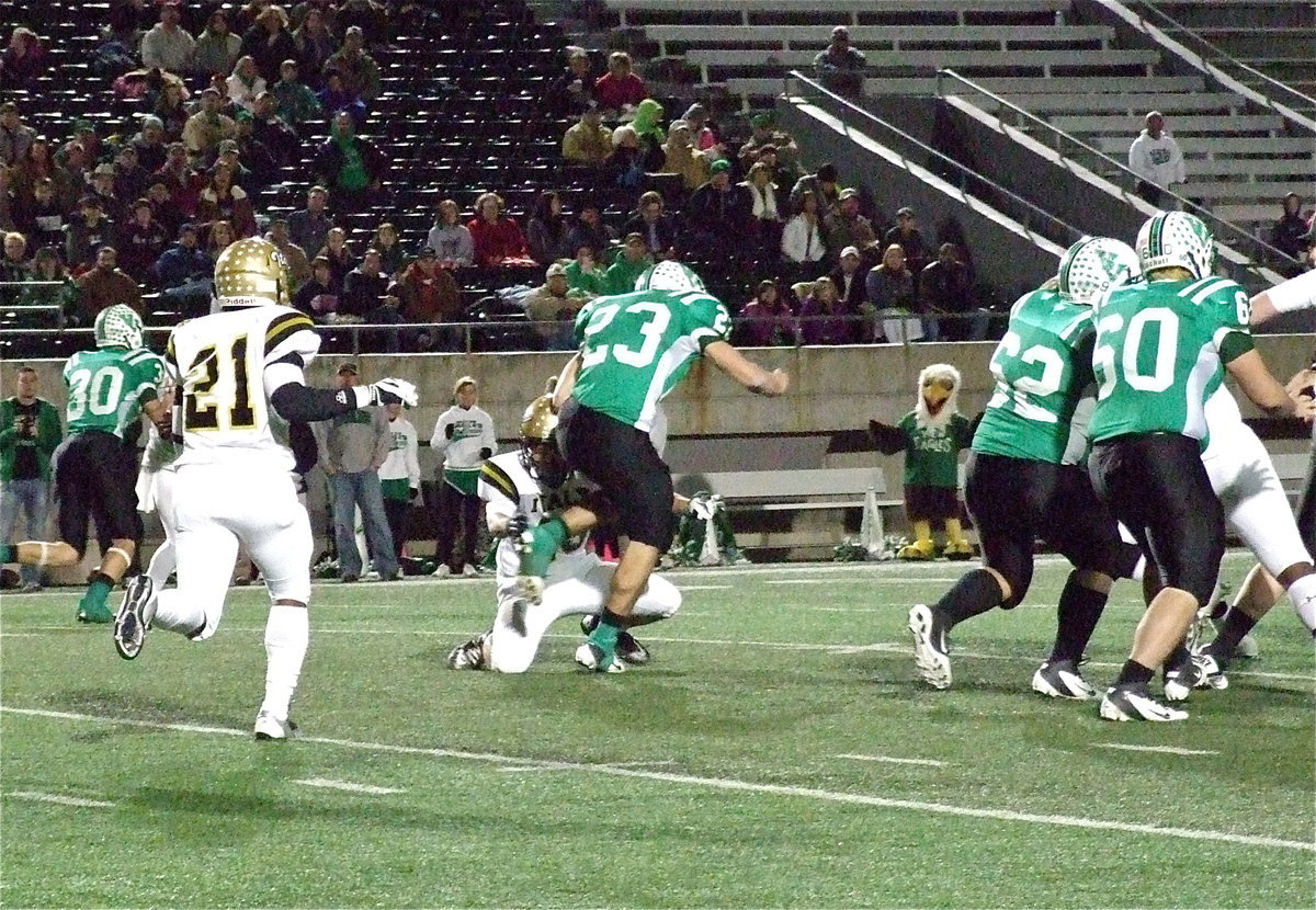 Image: Gladiator defender Hunter Merimon(45) wraps the legs of Eagle runner Landon Boaz(23).