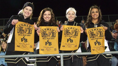 Image: Taylor Turner, Morgan Cockerham, Britney Chambers and Ashlyn Jacinto display golden rally rags provided by First State Bank of Italy. Rally rags were also given to the parents of Gladiator players.