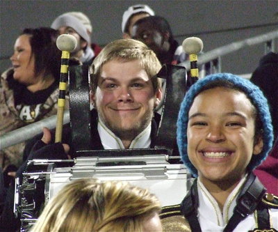 Image: Band members Gus Allen and April Lusk are smiling with excitement before kickoff.