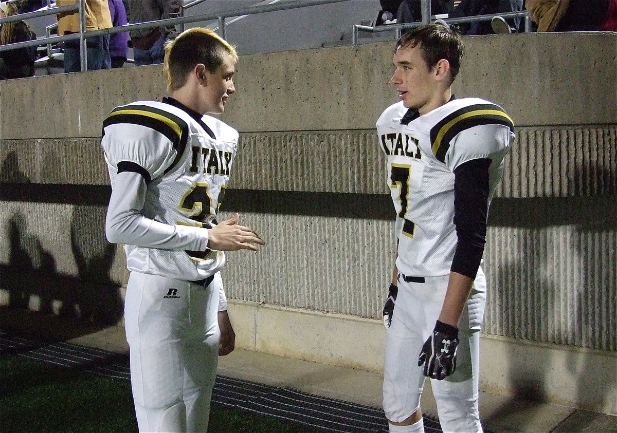 Image: Gladiators Ty Windham(36) and Ryan Connor(7) talk shop during the game.