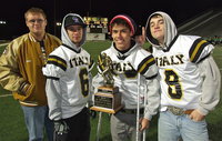 Image: Colin Newman, Caden Jacinto, Kelvin Joffre and Hayden Woods pose with Italy’s area championship trophy with the final score in the background, Gladiators 35 and Eagles 14.