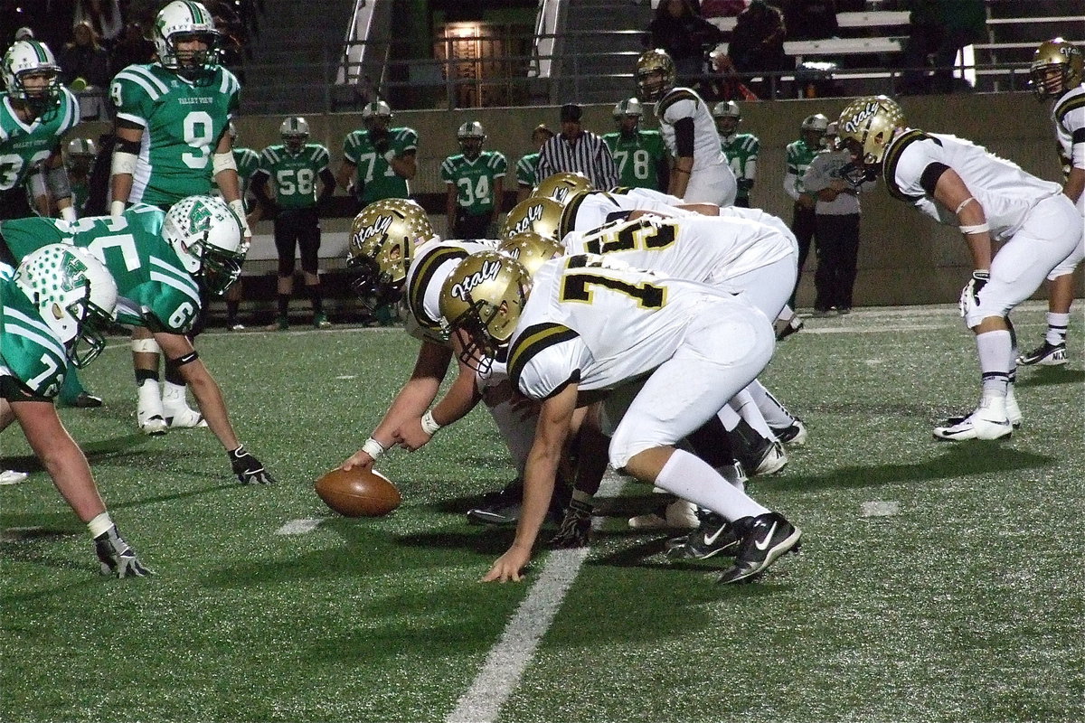 Image: Offensive tackle Cody Medrano(75) awaits the snap from teammate and center Zain Byers(50).