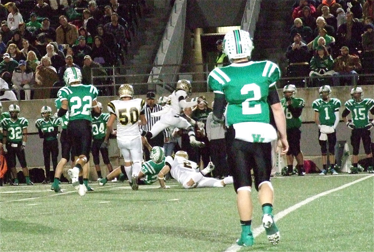 Image: Chase Hamilton(2) makes the play as teammate Eric Carson(12) uses his athleticism and avoids a late hit by flying into the Eagle sideline.