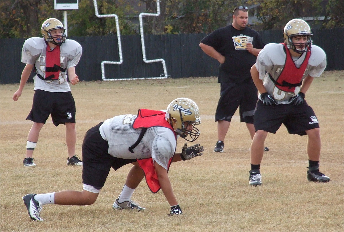 Image: John Escamilla, Reid Jacinto and Hunter Merimon on defense.