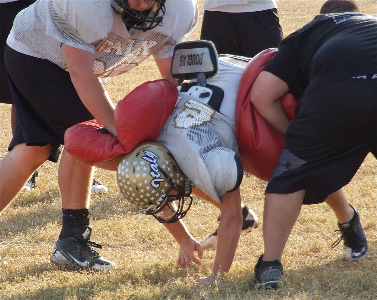 Image: Shad Newman bear crawls thru the gap.