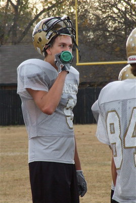 Image: Cole Hopkins hydrates during practice.