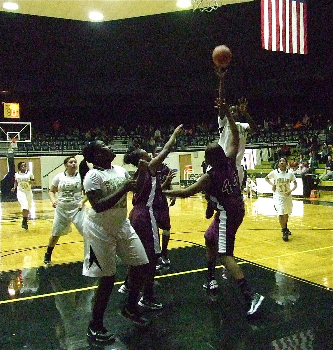 Image: Taleyia Wilson(22) gets in position to rebound as Kortnei “KJ3” Johnson(3) knocks down a shot in the lane.