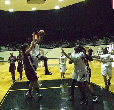Image: Taleyia Wilson(22) gets in position, yet again, to rebound as Kortnei Johnson(3) attacks the basket, yet again.