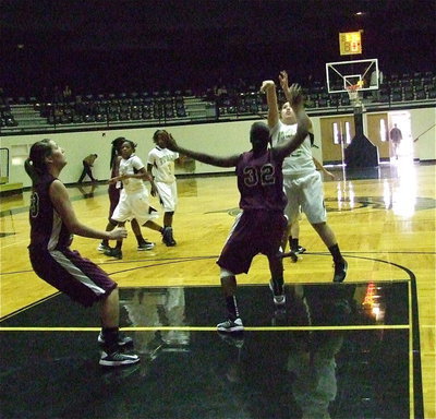Image: Monserrat Figueroa(25) swishes a turnaround jumper from the free-throw line.