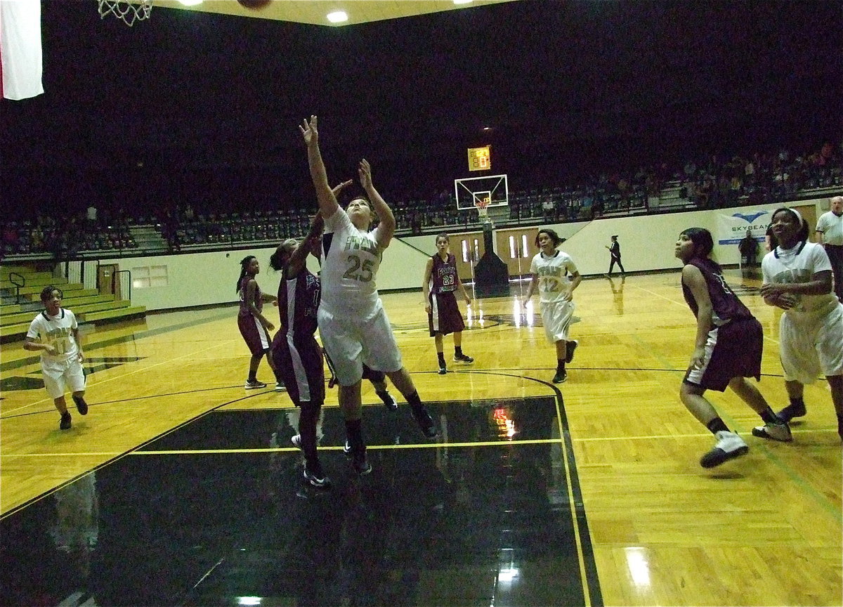 Image: Monserrat Figueroa(25) receives a pass and puts up a shot inside against a Faith Family defender.