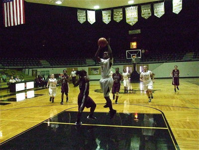 Image: Kortnei Johnson(3) gets the steal and puts in the shot for another basket.