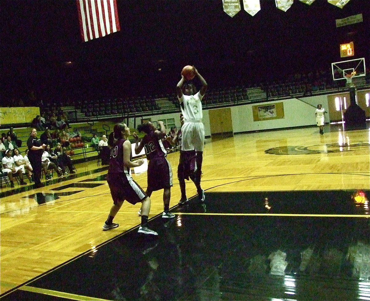 Image: Kortnei Johnson(3) gets altitude on her jump shot as the Lady Gladiators soar over Faith Family 63-14. Johnson finished the outing with 26-points