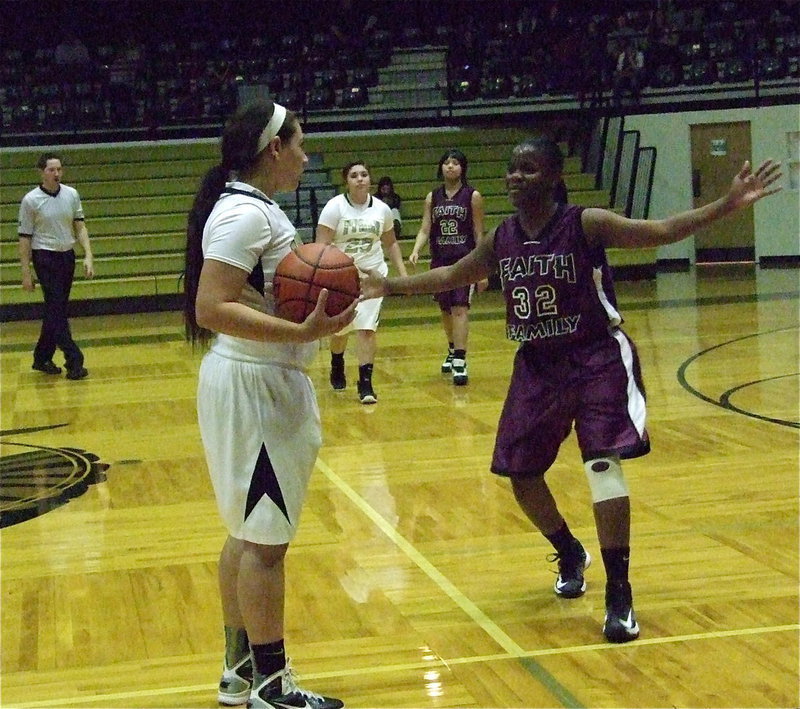 Image: Alyssa Richards(24) holds the ball with the final seconds ticking away as the Lady Gladiators advance to the second round of the IIBT by defeating Faith Family 63-14.