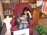 Image: Lupita Rincon, sophomore, enjoys the time with her book at the Read-A-Thon.
