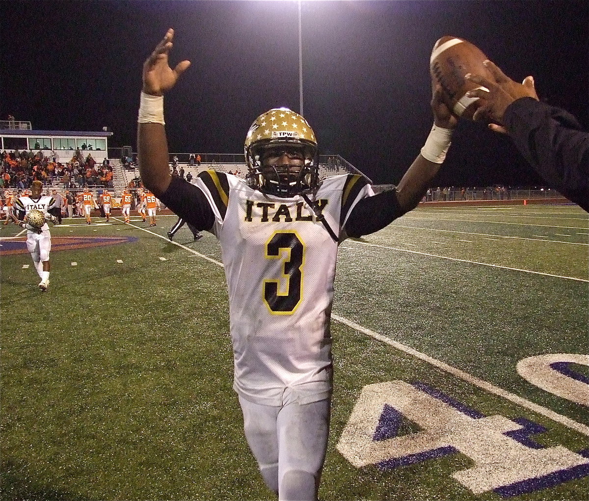 Image: Marvin Cox(3) takes a knee for the victory formation snap and then rises in triumph as Italy moves past Honey Grove 33-20 to claim the regional semifinal championship!