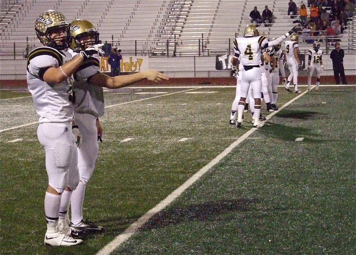 Image: Chase Hamilton(2) and Hayden Woods(65) give the sword chop as Italy prepares to kickoff to Honey Grove.