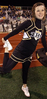 Image: Gladiator cheerleader Meagan Hooker gets warmed up for the second half.