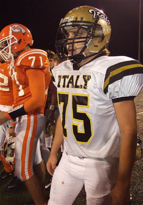 Image: Gladiator offensive tackle Cody Medrano(75) awaits the trophy presentation.