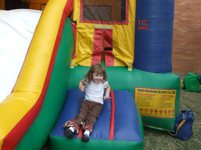 Image: Kiersten Dabney, age 3, enjoys the bounce house.