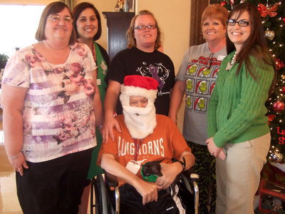 Image: Carolyn Powell, Amanda Wilsford, Emily Finley, Dodie Chambers, Darla Gardner all sharing a smile with the resident with the most spirit, Carl Blevins,
