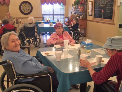 Image: Residents enjoying home baked cookies especially made for them by Carolyn Powell (activities director).