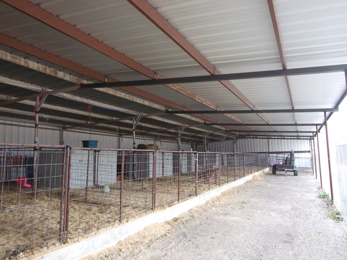 Image: New Ag barn has an extended roof to keep the animals warm and dry.