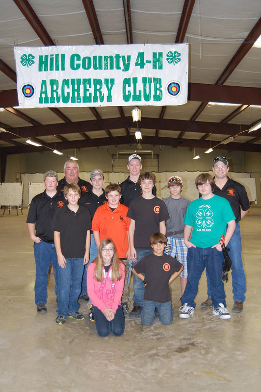 Image: Coaches and members of the Ellis County Shooting Sports 4-H archery team.