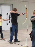 Image: Ryan Johnson shoots his recurve bow in the 4-H archery tourney.