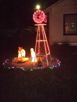 Image: Beautifully lit windmill and nativity scene.