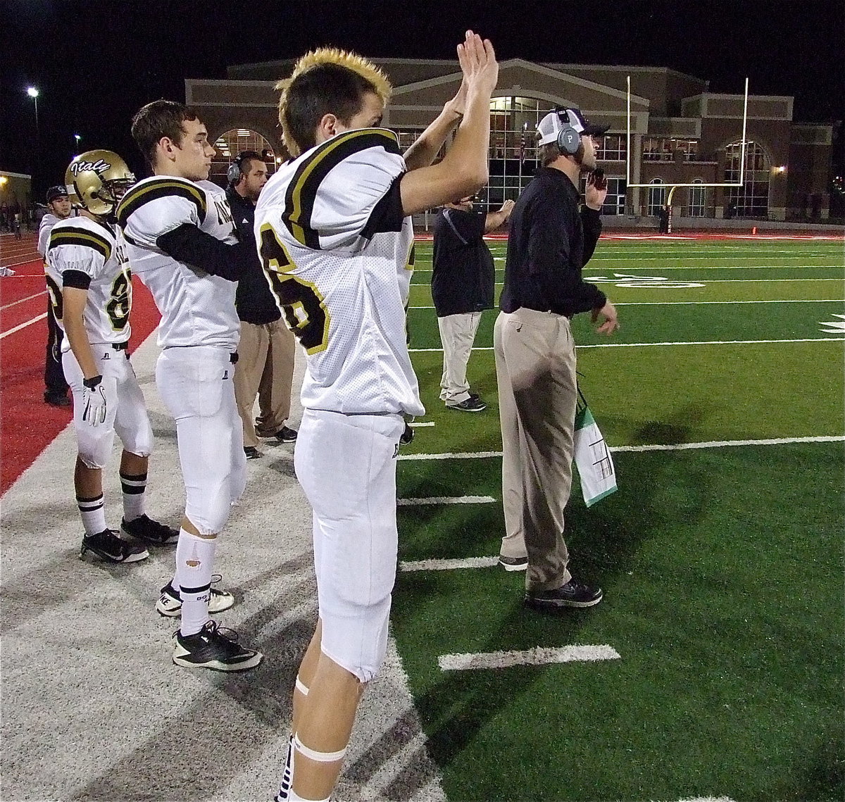 Image: Ty Windham(36) signals plays to the huddle….or is he?