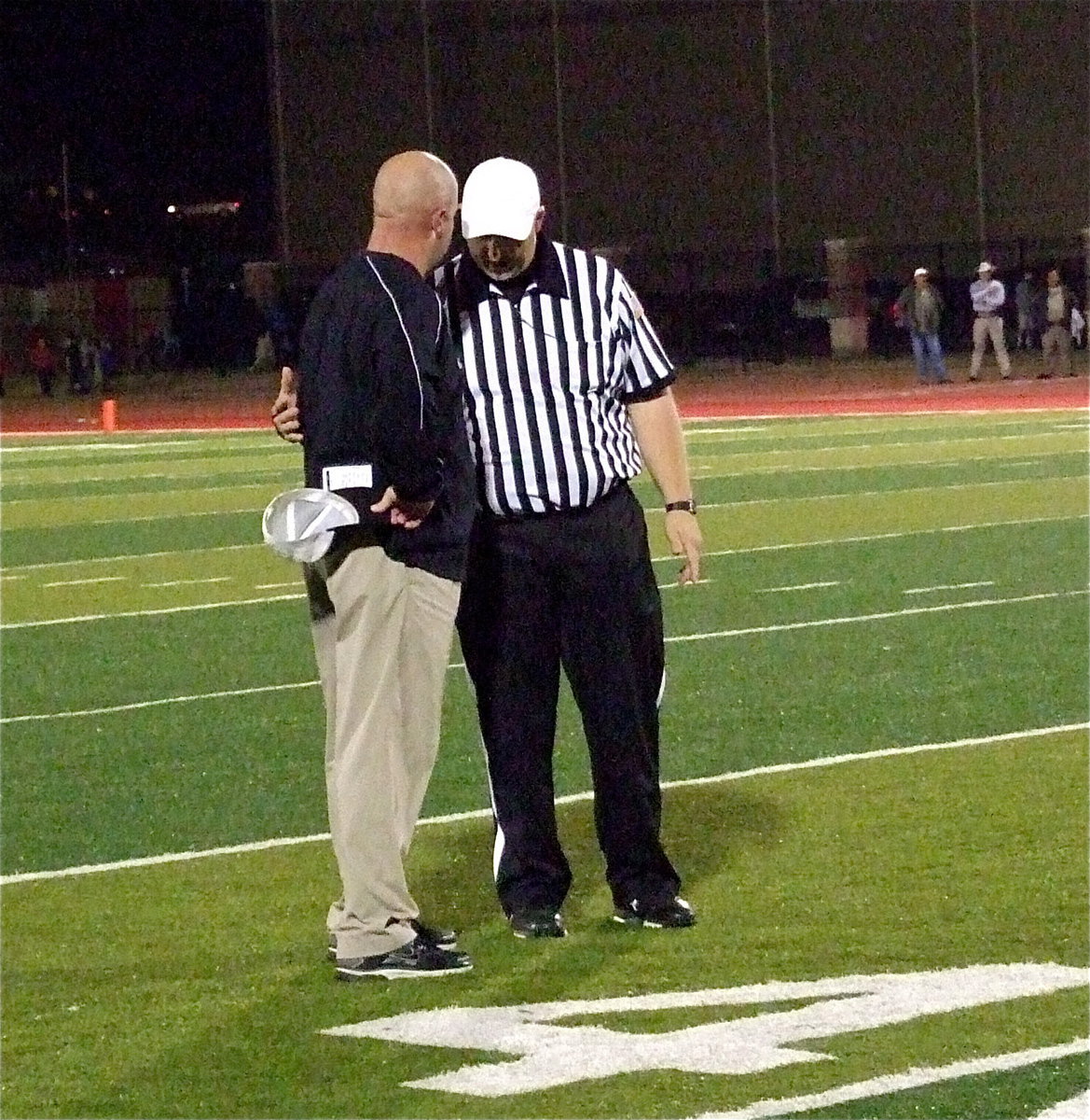 Image: Italy’s HFC/AD Hank Hollywood demands an explanation after seeing his quarterback Marvin Cox picked up and slammed down after the whistles had already blown. A face mask penalty was charged to Goldthwaite but no roughness call or ejection was enforced.