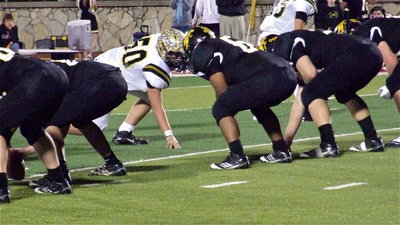 Image: Defensive end Zain Byers(50) keeps his eyes on the backfield while daring Goldthwaite to snap the ball.