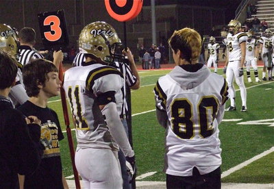 Image: Gladiator seniors Reid Jacinto(11) and Kelvin Joffre(80) talk strategy during the game.