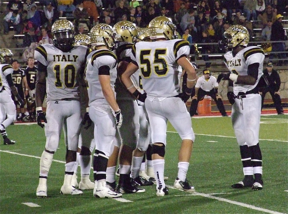 Image: Marvin Cox(3) begins to call a play to his offensive huddle.