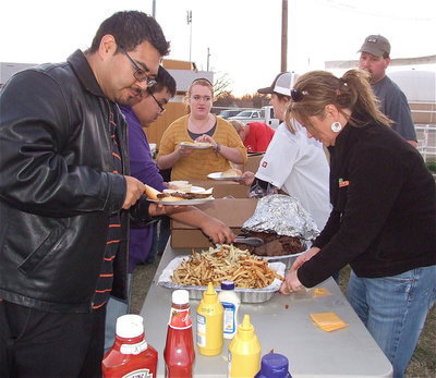 Image: Band instructor, Jesus Perez thinks having burgers for dinner never sounded so good.