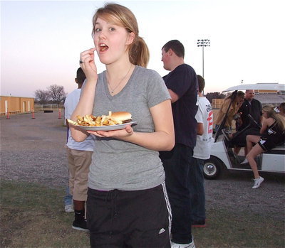 Image: IHS cheerleader Taylor Turner helps Italy devour the Eagles of Goldthwaite.