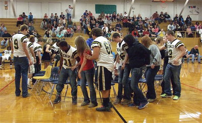 Image: While playing 20 questions where participants change seats according how they would answer a personal question, often resulting in several participants sitting on one chair. In this round, apparently everyone talks about Gladiator Football even when in the powder room.