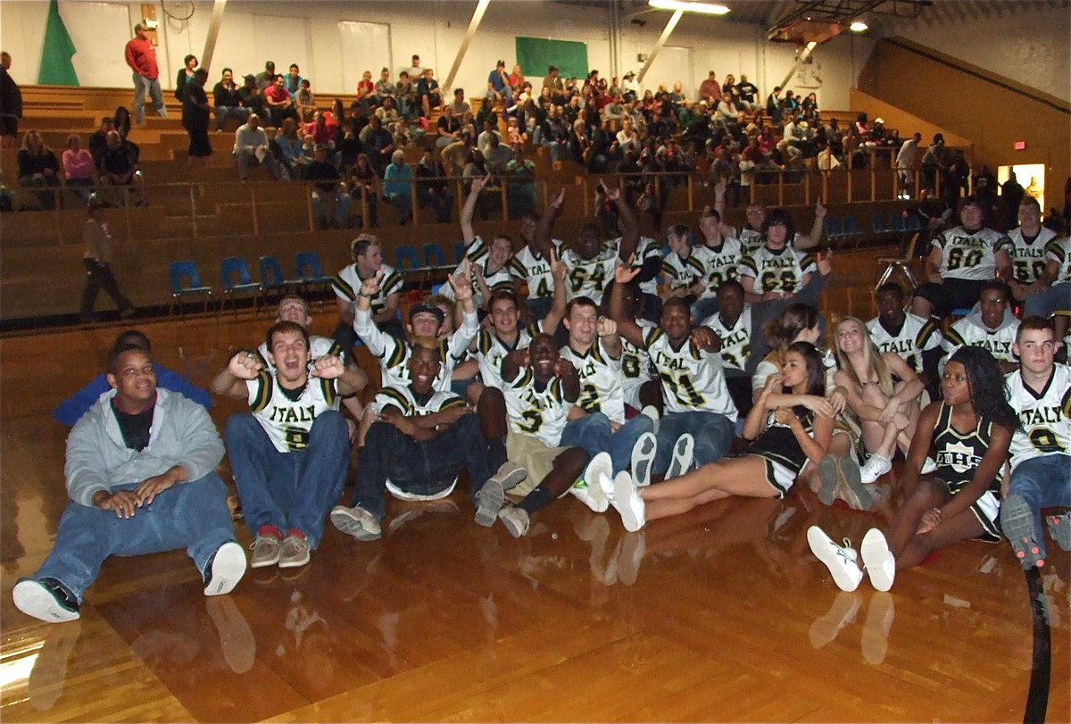 Image: Gladiator Regiment Band members, the Gladiator football players and the IHS cheerleaders all gather around for the video highlights.