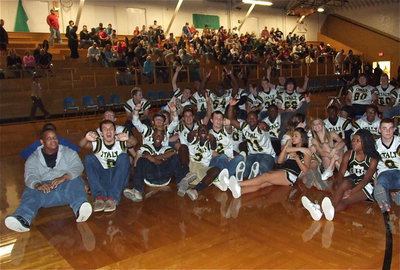 Image: Gladiator Regiment Band members, the Gladiator football players and the IHS cheerleaders all gather around for the video highlights.