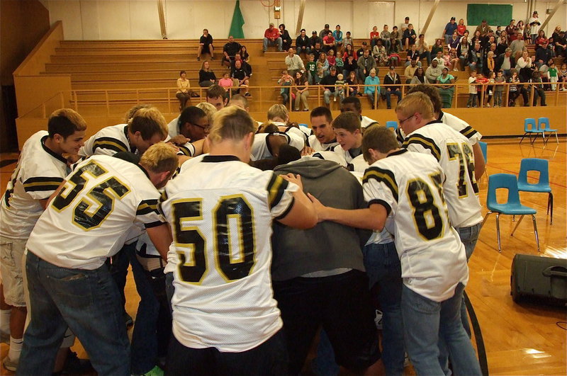 Image: Slap hands, slap hands! The Gladiators huddle during the pep rally.