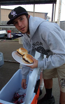 Image: Senior Gladiator Caden Jacinto grabs a soda to wash down the chow.