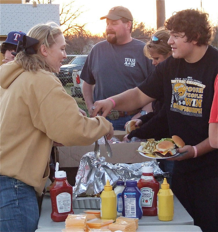 Image: Jaclynn Lewis and Kevin Roldan fight over the tongs and then the Gladiators went on to win the fight over the Goldthwaite Eagles, 14-3  to claim the 2012 regional quarterfinal championship.