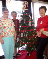 Image: Titus Women Angie Knott, Arveal Wimbish and Maxine Morris standing by the Angel Tree.