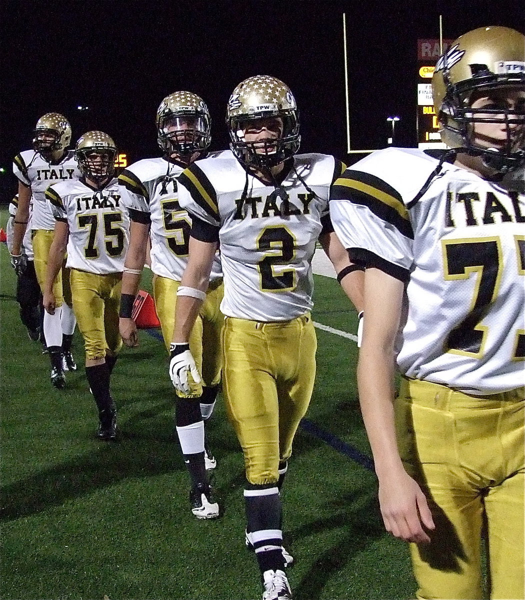 Image: Gladiators Brandon Connor(77), Chase Hamilton(2), Zackery Boykin(55), Cody Medrano(75) and Cole Hopkins(9) receive cheers from fans as they attempt to march past Stamford and into the state championship round.