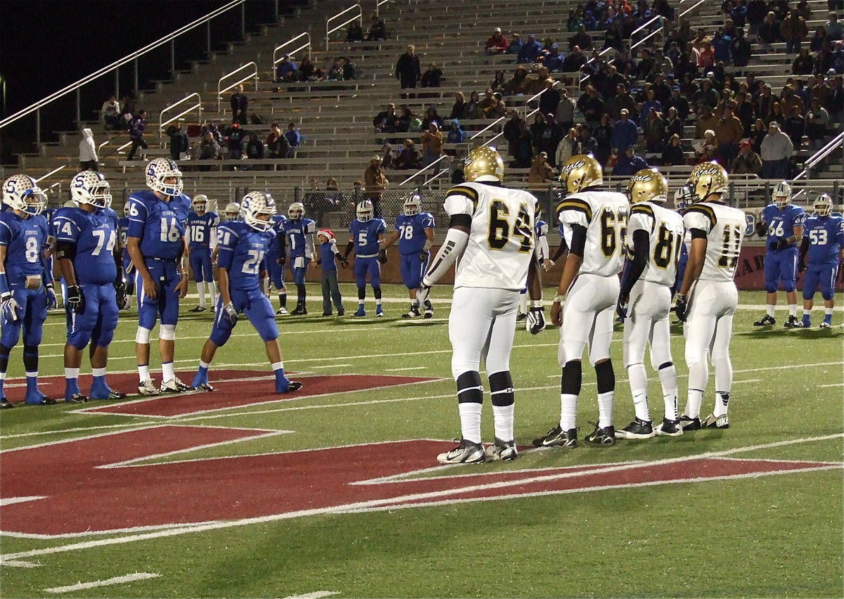 Image: Gladiator senior captains Adrian Reed(64), John Hughes(62), Kelvin Joffre(80) and Reid Jacinto(11) during the pre-game coin toss.