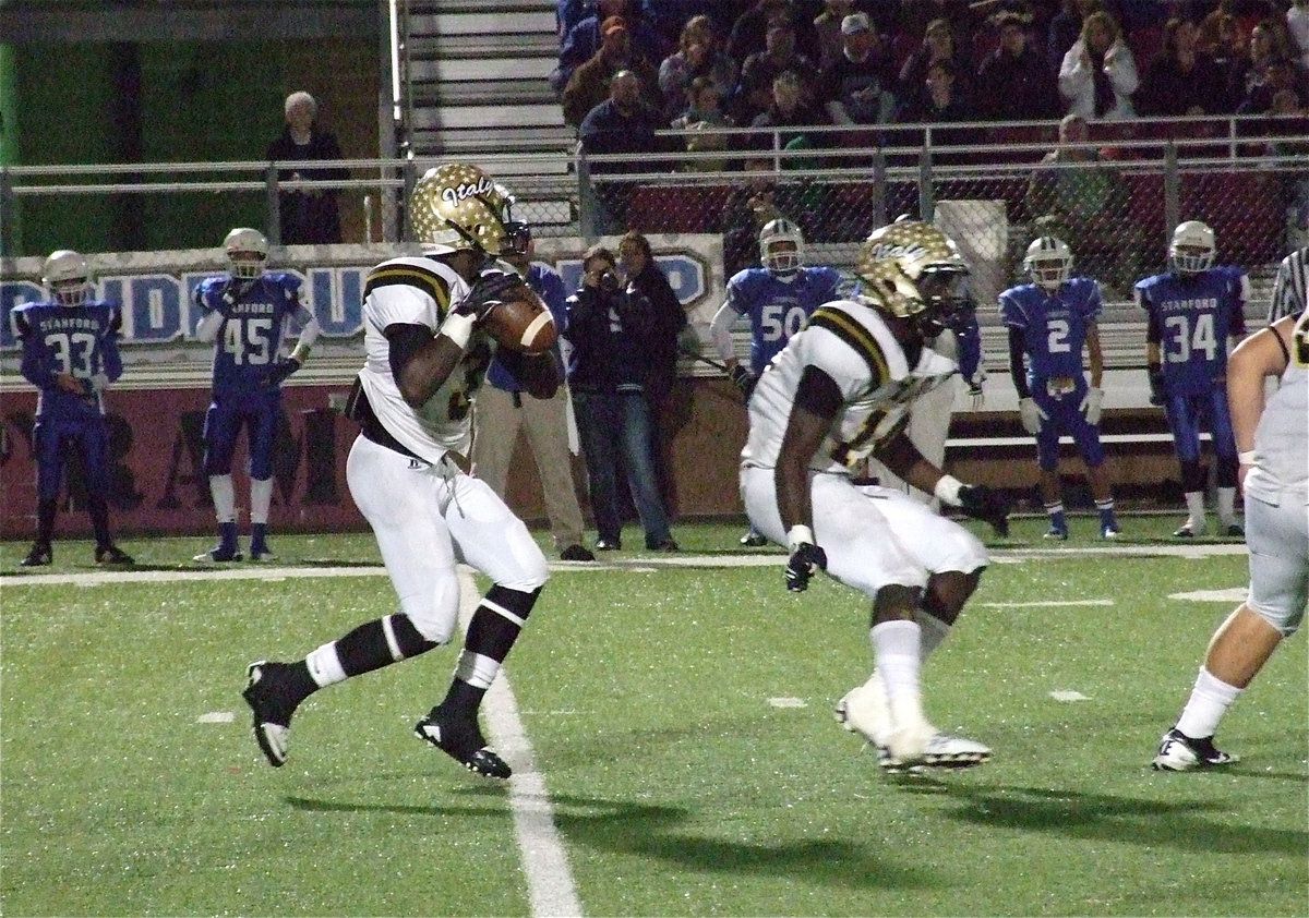 Image: Marvin Cox(3) sets up behind Ryheem Walker(10) who looks for a Bulldog to block.