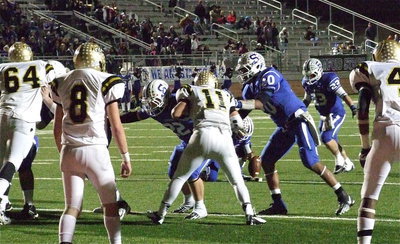 Image: Adrian Reed(64), Hayden Woods(8), Reid Jacinto(11) and Trevon Robertson(4) make sure Stamford only kicks a field goal instead of trying a fake.