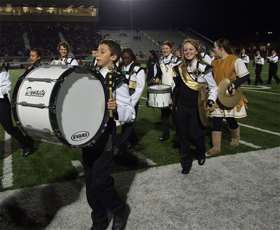 Image: Noah Ramirez, Brenya Williams, Whitney Wolaver, Maddie Pittman and Reagan Adams are pumped up after the band’s rocking halftime show.